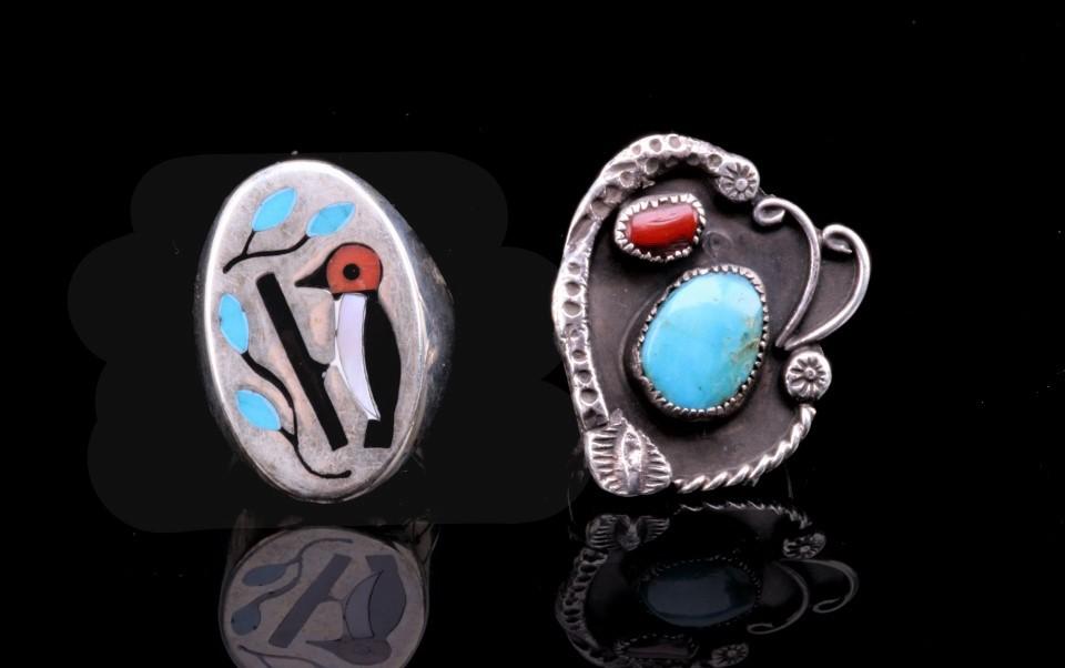 Navajo Coral, Turquoise & Sterling Silver Rings: Included in this lot is a pair of Navajo Native American branch coral, turquoise and sterling silver rings. The first ring shows a bird sitting on a tree branch. The bird is inlaid into a sterling sil