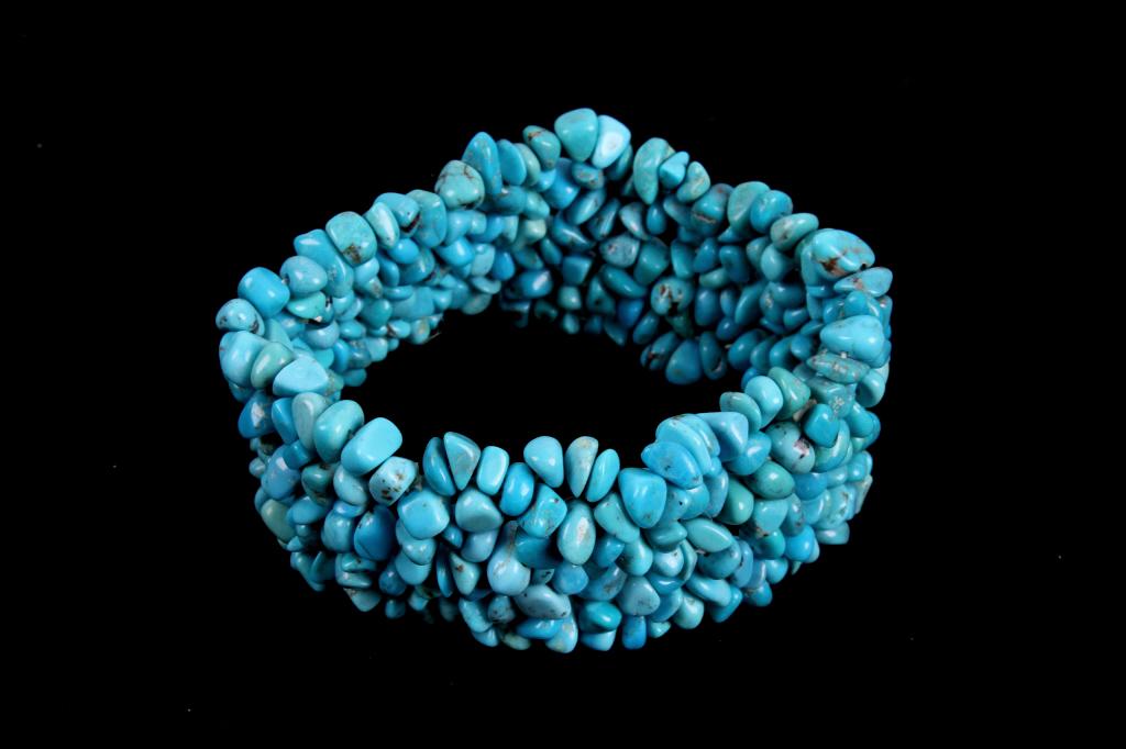 Sleeping Beauty Turquoise Nugget Stone Bracelet: Included in this lot is a Sleeping Beauty turquoise nugget stone stretch bracelet. This bracelet features many small, loose Sleeping Beauty turquoise nuggets. The stones are kept together with an elas
