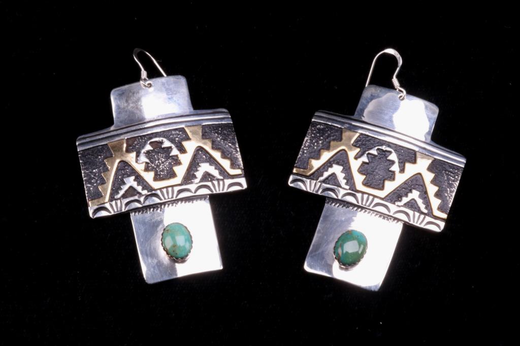 Navajo T&R Singer Sterling & Turquoise Earrings: Included in this lot is a pair of Navajo sterling silver and gold overlay earrings by Tommy and Rose Singer. Tommy Singer was a master Navajo silversmith artist, whose pieces have captivated collector