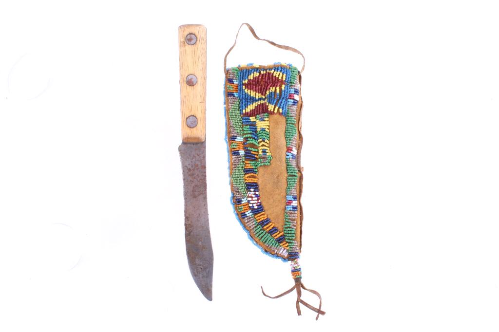 Sioux Fully Beaded Leather Sheath & Knife 19th C.: The lot features a fantastic, circa 1800’s, beaded sheath and trade knife from the Sioux Native American Indians. The sheath shows a stiff Indian tanned Rocky Mountain Elk hide parfleche with amazin