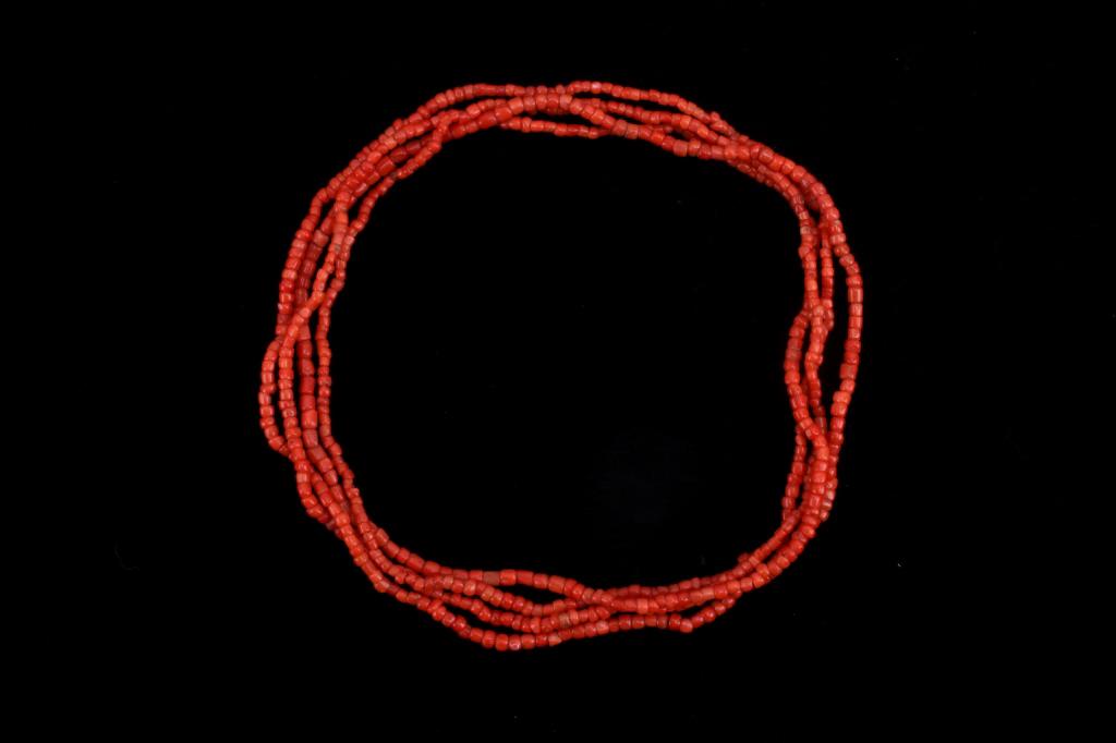 Navajo Coral Beaded Heishi Necklace: This lot features a Navajo Coral beaded, Heishi cecklace. The literal meaning of heishi is "shell" and it specifically refers to pieces of shell that have been drilled and ground into beads and then s