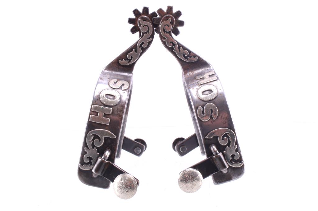 Personalized Silver Overlay SB Star Spur Pair: Featured in this lot is this personalized silver overlay SB Star spur pair. This is a personalized pair with silver overlay and initials of 'SOH'; it shows floral decoration of silver overlay on the s