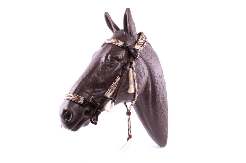 Deer Lodge, MT Prison Horsehair Bridle C. 1950s: Featured in this lot is this Deer Lodge, MT prison horsehair bridle, circa 1950's-60's. This bridle shows exceptional craftsmanship with a twisting of variety of dyed horse hair and a core hitched des
