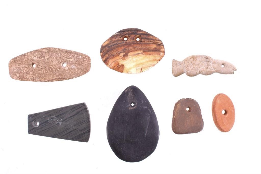 Prehistoric - Modern Multi Stone Gorget Collection: Featured in this lot is this collection of gorgets, ranging from Prehistoric age to Modern age and formed from a variety of stone construction. There are seven gorgets total in this collection. The st