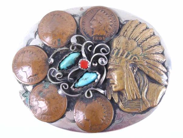 Navajo Turquoise Coral & Penny Belt Buckle: Included in this lot is a Navajo Native American sterling silver belt buckle with turquoise, coral, and copper pennies. The face of the buckle displays sterling silver construction with silver vines a