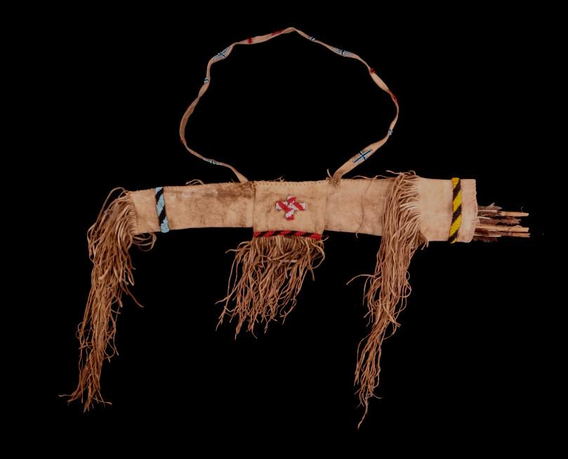 Comanche Beaded Hide Arrow Quiver w/ Arrows: This is a beautiful 19th Century Southern Plains hide arrow quiver and arrows attributed to the Comanche Native American Indians in Northern Texas. The piece is comprised of Indian brain-tanned Buffal