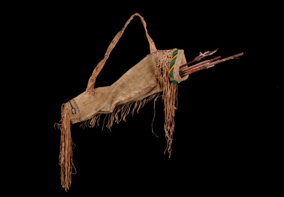 Apache Beaded Hide Arrow Quiver w/ Arrows: The lot features an beaded Indian tanned buckskin arrow quiver and four arrows attributed to the Apache Native American Indians of circa 1890. This early Reservation late Indian wars set shows four cr