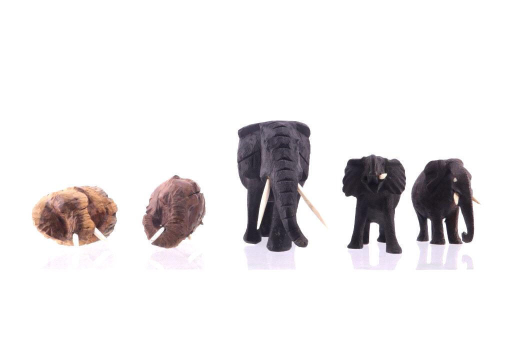 South African Leadwood Elephant Collection: Featured in this lot is this collection of South African Leadwood elephant carvings. There are three carvings and two knobs in this collection. The hand carved elephant statues show wonderful craftsma