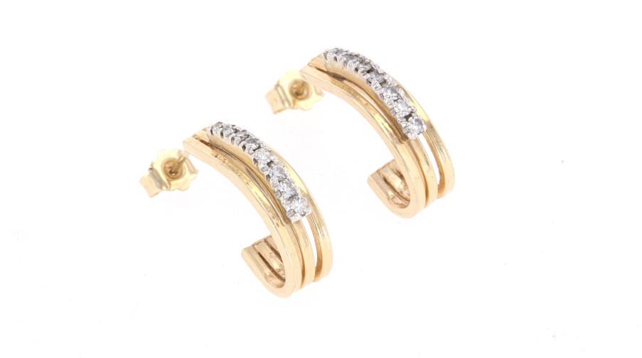 Estate Vintage Diamond & 14k Yellow Gold Earrings: Featured in this lot is this pair of estate vintage diamond and 14k yellow gold earrings. The earrings feature a wonderfully and professionally crafted 14k yellow gold half hoop earring set with a tot