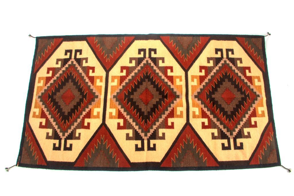 Ganado Klagetoh Flor Rug by Emilio Reyna: This is an excellent, hand woven flat weave rug by master weaver Emilio Reyna. It was made using 100% soft, fine hand spun yarns in a beautiful Ganado Klagetoh Flor pattern. The rug was hand woven wit