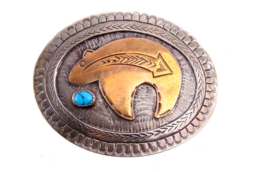 Native American Silver & Brass Bear Belt Buckle: Featured in this lot is an Armand American Horse alpaca silver, brass, and turquoise bear fetish belt buckle. Armand American Horse (1982- ) is a Lakota Native American Indian silversmith artist. The 