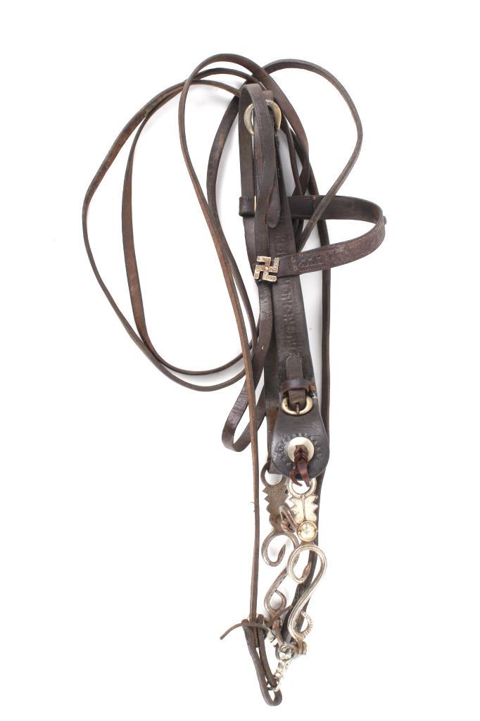Les Vogt Rattlesnake & 1920's Whirling Log Bridle: The lot features a phenominal 1920's Whirling Log tooled and silver spot headstall, bridle and reins paired with one of Les Vogt's earliest rattlesnake silver inlaid and mounted horse bit dating to th
