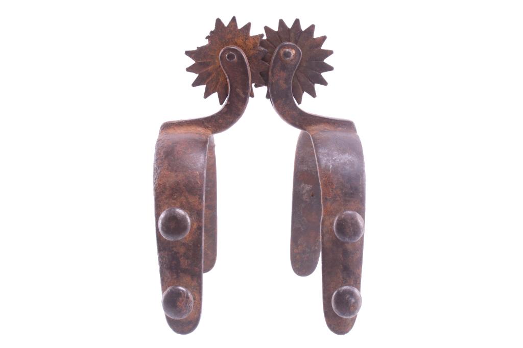 Buermann "OK" Pattern Spurs circa 19th Century: Featured in this lot is this pair of Buermann "OK" pattern spurs, circa 19th century. The spurs show a wonderful design consistent with Buermann’s design; Buermann is best known for the O.K. style s