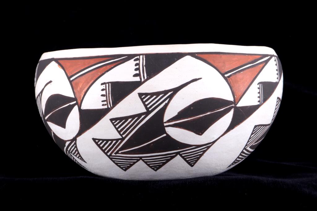 Acoma Juana Leno (1917-2000) Polychrome Pottery: Featured in this lot is this polychrome pottery vessel from Acoma potter Juana Leno born 1917 and passed 2000. The pot shows a traditional form with a beautifully hand painted polychrome geometric pat