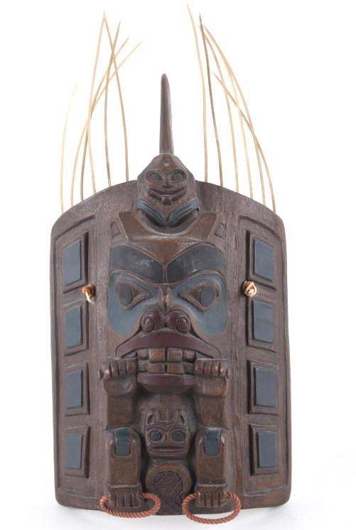Kwakwaka'wakw Haida Headdress Frontlet c. 1940s: Featured in this lot is this Kwakwaka'wakw Haida headdress frontlet, circa 1950's. The headdress features a resin construction with a beautiful arrangement of totems featuring animal figural of a squi