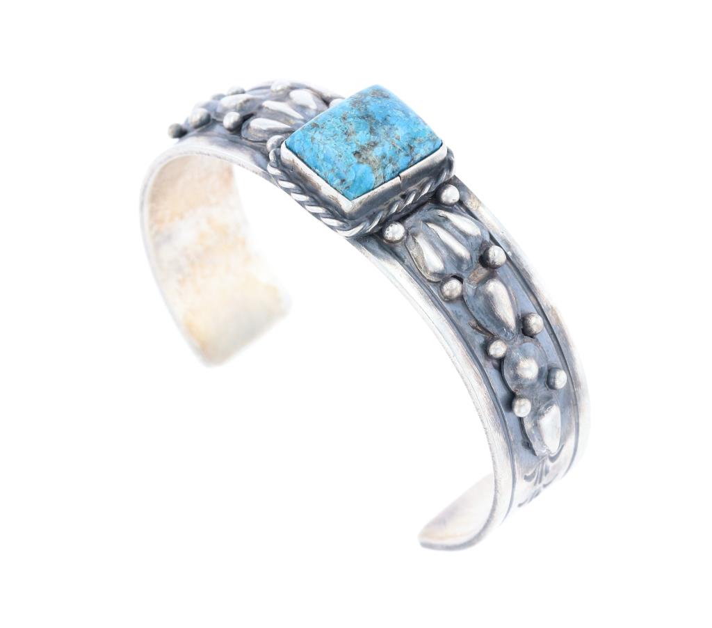 Navajo Kingman Turquoise Sterling Cuff R. Enriquez: Featured in this lot is this sterling silver and Kingman turquoise bracelet from Navajo artist Rick Enriquez. The bracelet features a wonderfully and professionally crafted sterling silver bracelet wi