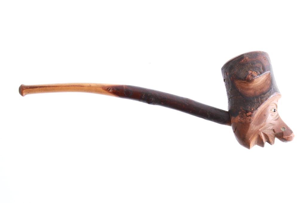 Hand Carved Forest Spirit Willow Branch Pipe: Featured in this lot is this hand carved forest spirit willow branch pipe. The pipe shows a professionally and hand carved forest spirit with bead eyes; it is constructed form a willow branch. The con