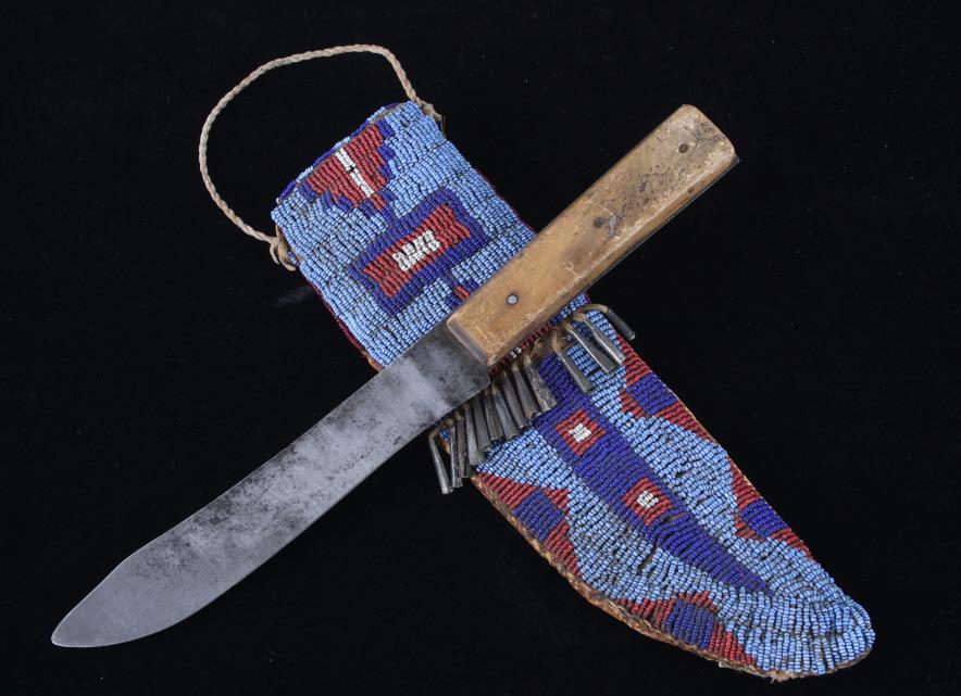 C. 1870 Hunkpapa Sioux Beaded Sheath & Trade Knife: This is an outstanding beaded sheath and trade knife dating to circa 1870 from the Hunkpapa Sioux Native American Indians and is from the Bruce VanLandingham Sundog collection. The sheath is construct
