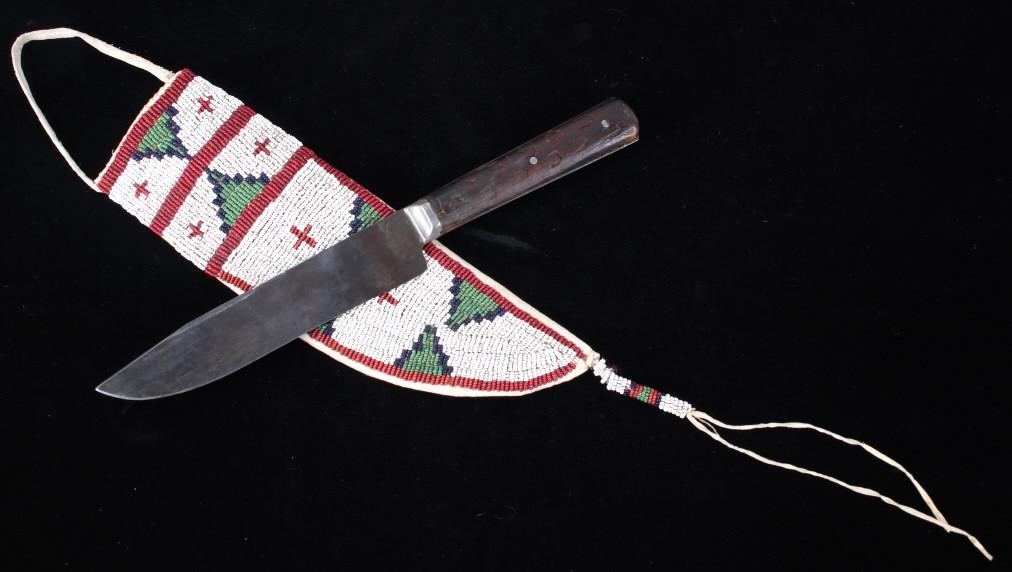 Northern Cheyenne Beaded Sheath & Knife c. 1870: This is an excellent beaded parfleche hide covered sheath with trade knife from the Northern Cheyenne Native American Indians and dating to circa 1870. This circa 1870 Indian Wars era original authent