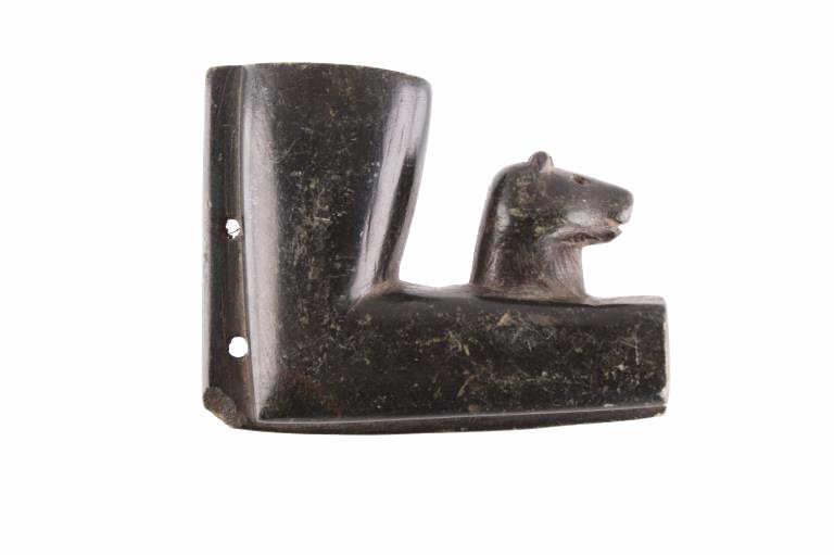 Eastern Sioux Bear Effigy Pipe Bowl c. 1850-1875: The lot features an excellent Eastern Sioux pipe bowl with bear effigy carving dating to circa 1850-1875 from the Bruce VanLandingham Sundog collection. The piece is hand carved from black steatite in