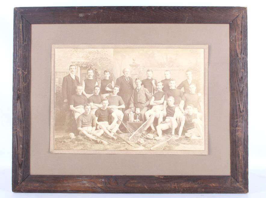 1920's Men's Collegiate Lacrosse Team Photograph: Featured in this lot is this men's collegiate lacrosse team photograph circa 1920's. This is a great photograph of a men's collegiate lacrosse team with coaches present and shows the men holding their