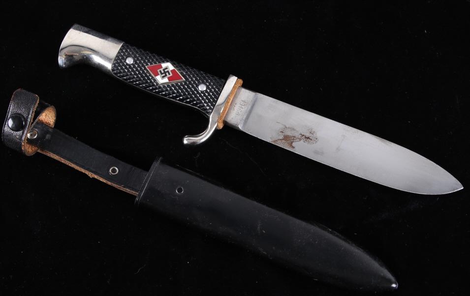 WWII German Army Dagger by PIC Solingen: This lot features a WWII era style German Army dagger with a nickle plated hilt fitted with checkered plastic grips, painted black steel scabbard with leather belt loop, predecessor to the German Scou