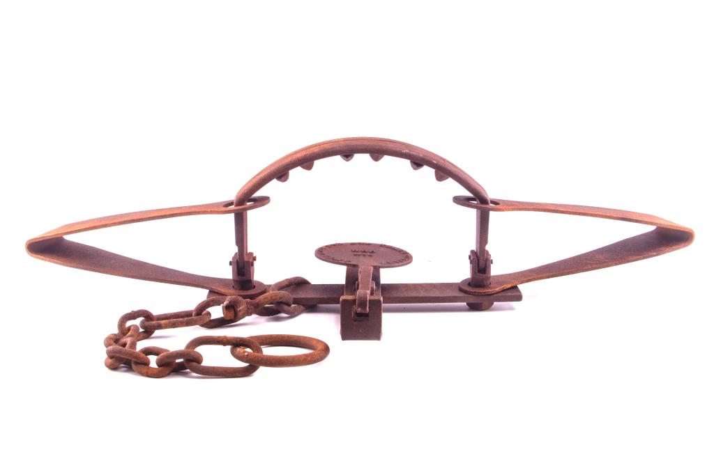 American Fur & Trade HBC No. 6 Grizzly Bear Trap: This is a large grizzly bear trap. The pan is marked "American Fur and Trade Company HBC No. 6". The trap features a double spring composition with a heavy gauge drag chain and ring. The grizzly bear 