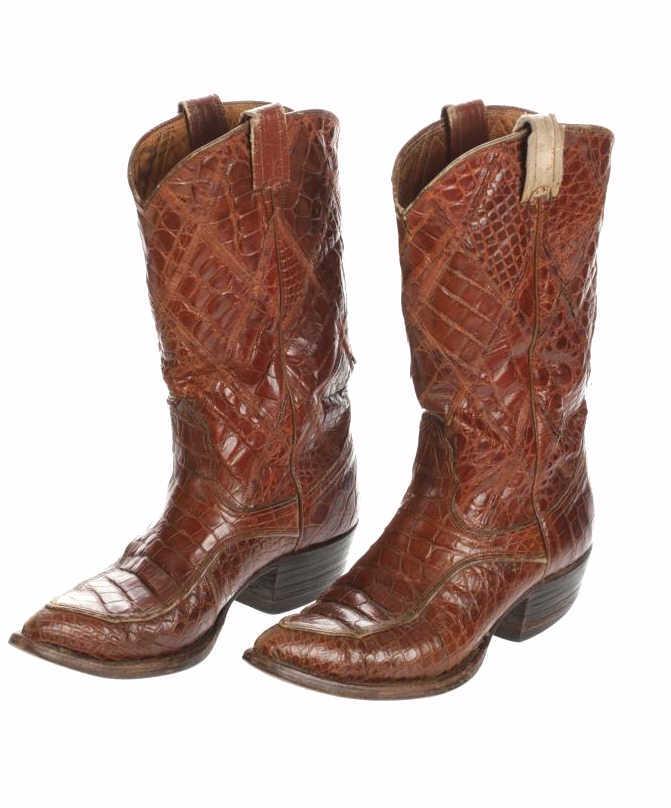 c. 1970's Nocona Sea Turtle Leather Cowboy Boots: The lot features a rare circa 1970’s Nocona Sea Turtle leather western cowboy men’s boots. The boots are comprised of rare 100% sea turtle leather with leather boot loops and shows a two-l