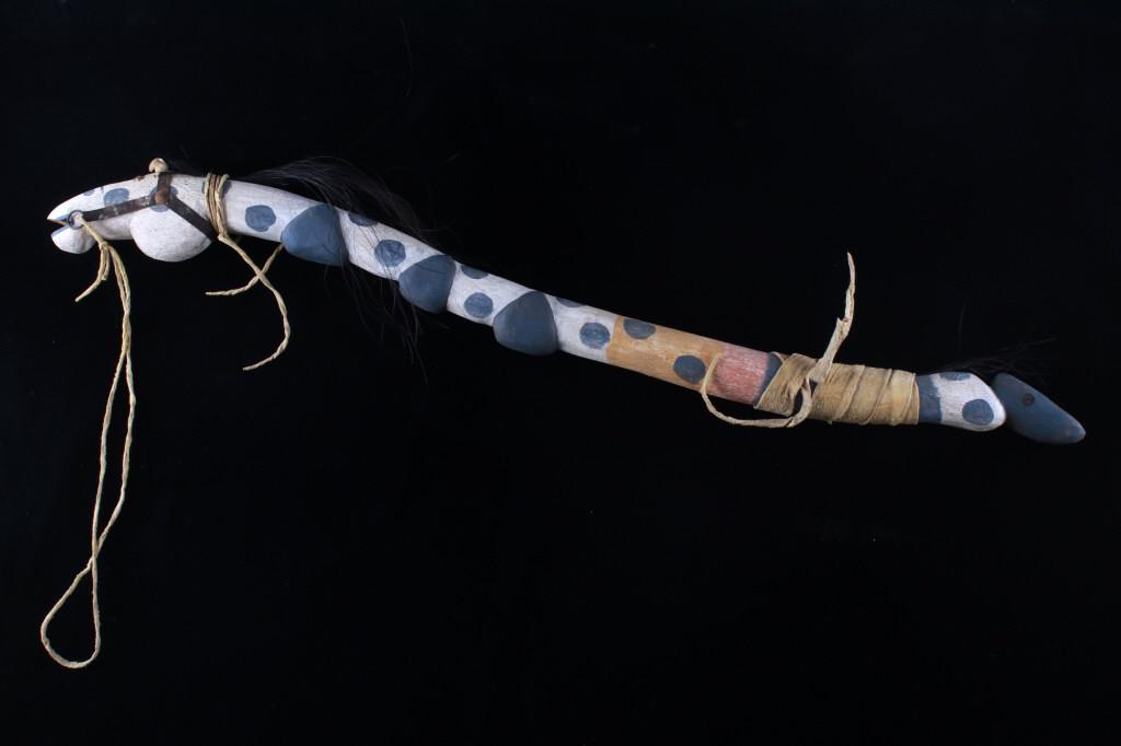 Lakota Sioux N.J. Little Wounded Dance Horse Club: The lot features an original hand carved polychrome painted and Indian hide wrapped horse dance staff or club attributed to Lakota Sioux Indian artist Nathan James Little Wounded. The piece is burn st