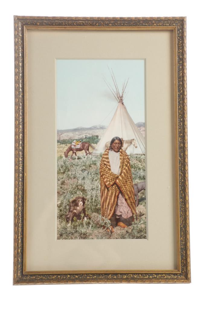 A Crow Indian, William Henry Jackson Chromo 1902: Featured in this lot is an original William Henry Jackson Chromo, "A Crow Indian", 1902, depicting a solitary, blanket-wrapped Crow Native American standing in the foreground with two dogs alongside,