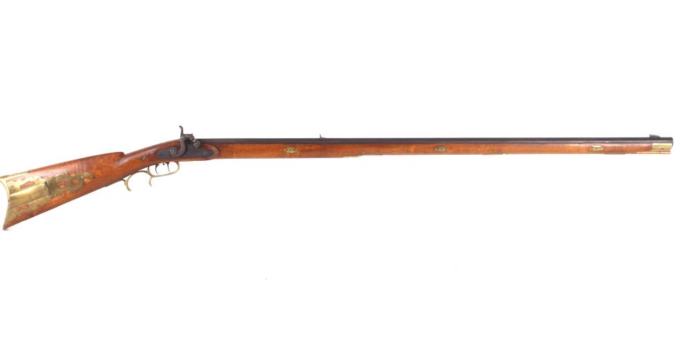 J.B. Robertson 1900s Percussion Cap 36 Cal Rifle: Featured in this lot we have a American made percussion cap rifle signed J.B. Robertson originating from the 20th century and chambered in 36 caliber. The rifle displays a 38 1/4" long octagonal rifle