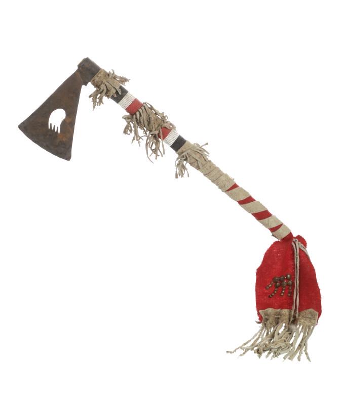 Lakota Sioux Beaded Forged Tomahawk J. Young Buck: The piece shows a forged metal war axe tomahawk head with bear paw cutout on a beaded hide leather clothe covered handle from Lakota Sioux Indian John Young Buck. John Young Buck was born in 1947 and