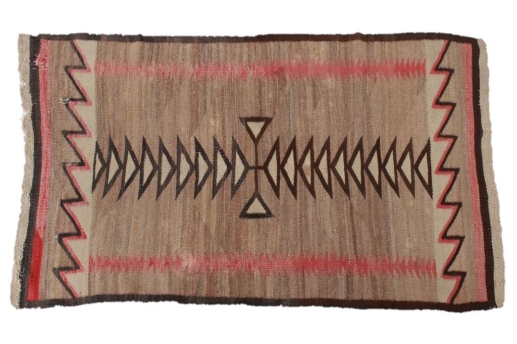 Navajo Klagetoh Trading Post Rug c. 1930's: Featured in this lot is this Navajo Klagetoh Trading Post rug circa 1930's. The rug features a wonderfully and professionally that features geometric patterns that phase into a central medallion compr
