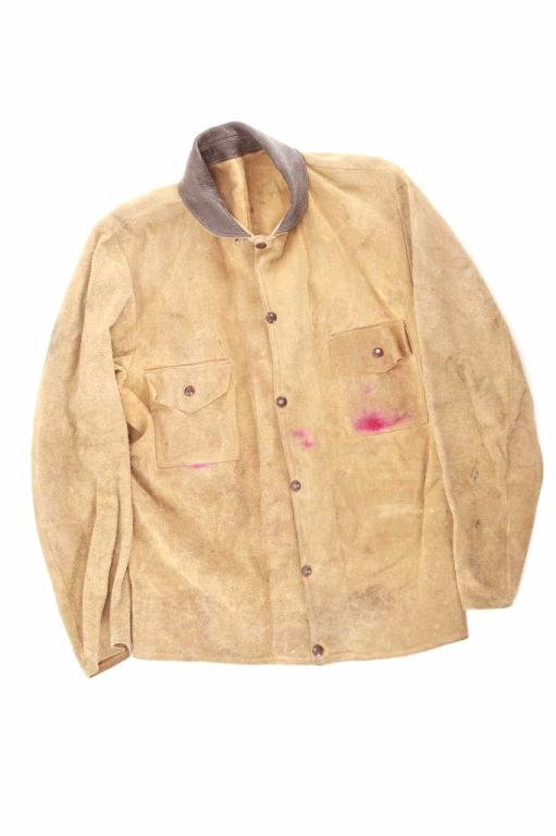 The Cody Rancher Rough Out Leather Jacket: Featured in this lot is this The Cody Rancher rough out leather jacket. The jacket features a wonderfully crafted leather construction that features a rough out design with brass button up constructio