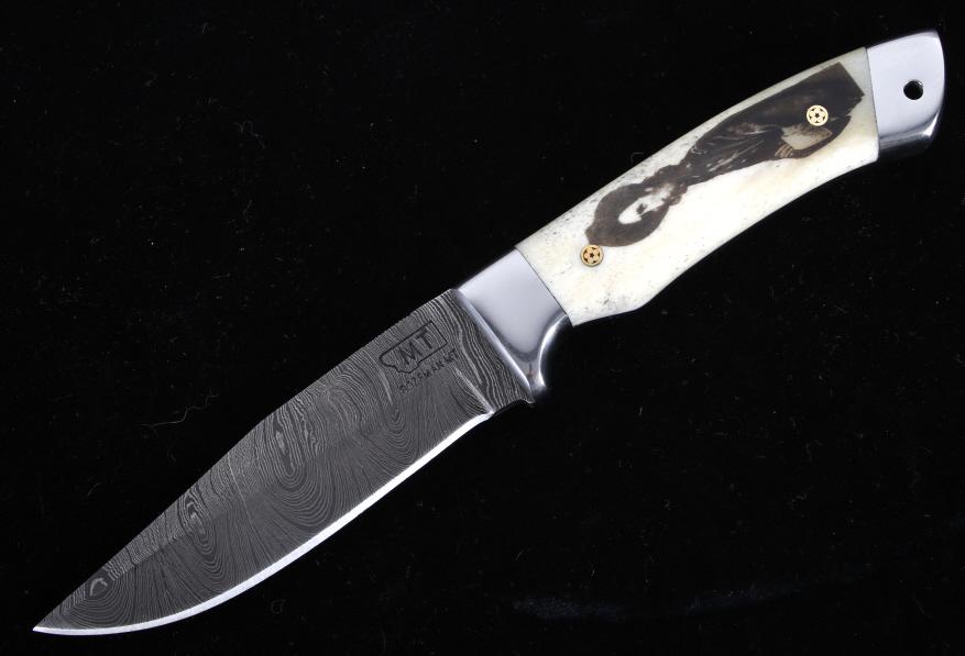 Montana Territory Custer Scrimshaw Damascus Knife: This is an original Montana Territory Knives of Bozeman, Montana knife with an excellent George Custer portrait scrimshaw artwork. This knife is truly a work of “Montana” art as it shows the portr