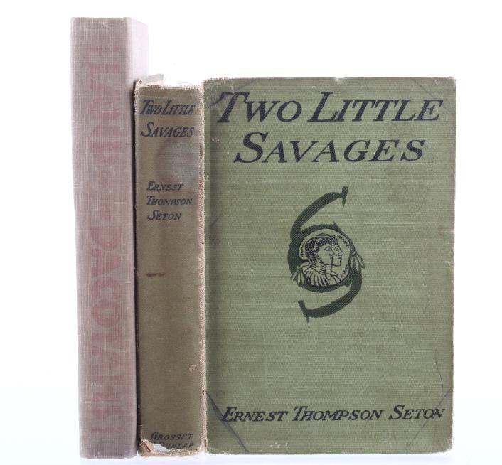 Pair of Native American & Western Books: Included in this lot we have a pair of Native American and western books. The books are titled "Two Little Savages" by Ernest Thompson Seton and "Land of the Dacotahs" by Bruce Nelson. The Two Little