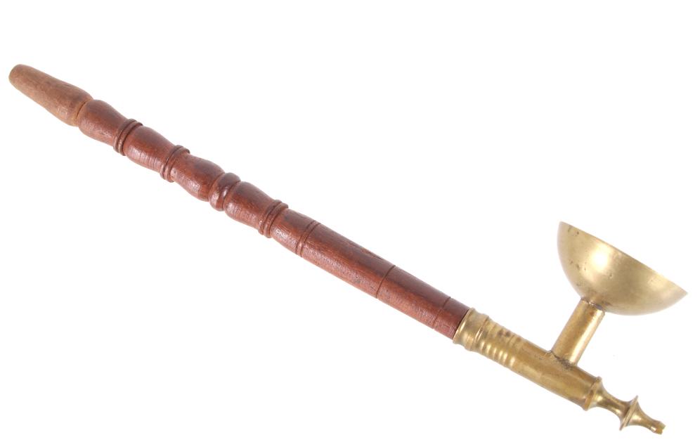 Asian Scrolled Wood And Brass Opium Pipe: In this lot is offered a vintage Asian opium smoking pipe consisting of a scrolled wood stem attached to a brass open bowl and brass finial tip. Archaeological investigation has linked the first smoki