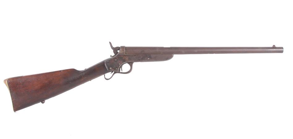 Sharps & Hanks Short .52 1859 Cavalry Carbine: Featured in this lot is a Sharps and Hanks short rimfire Model 1859 saddle ring cavalry carbine chambered in .52 caliber. The rifle displays a 19" long round barrel, walnut stock, lever breech system,