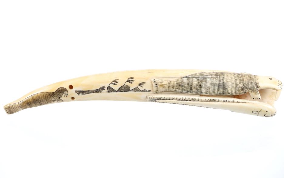 Early Inuit Highly Carved Walrus Cribbage Board: The is an amazing, highly carved walrus tusk cribbage board from the Inuit or Eskimo Native Americans dating to the late 19th Century to early 20th Century. The piece is carved from a Walrus Tusk show