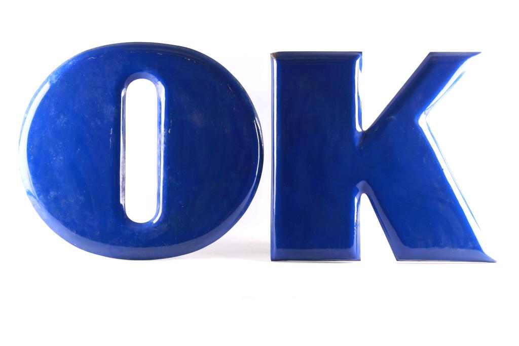 Chevrolet "OK" Porcelain Enamel Lettering Sign: Featured in this lot is this Chevrolet " OK" porcelain enamel lettering sign circa 1950's. This is a pair of wonderfully and professionally crafted porcelain enamel construction that features two inde