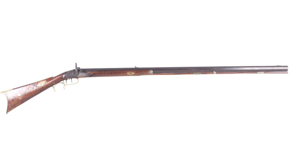 American Percussion .36 Cal Pennsylvania Rifle: Featured in this lot is an American made percussion cap black powder Pennsylvania rifle chambered in .36 caliber. The rifle displays a 38 1/2" long barrel, walnut stock, brass trigger guard, dual trig