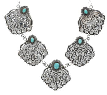 Mary Thomas (Navajo / Dine, 1944-2017) Necklace: This is a wonderful Mary Thomas, Navajo sterling silver and turquoise necklace, of a grand design and size. The necklace exhibits a unique lariat, like four large pendant design with amazing repousse