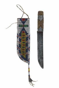 C. 1870's Sioux Beaded Sheath & Inlaid Trade Knife: This lot features a fantastic, authentic circa 1870s beaded buckskin parfleche lined sheath and pewter inlaid trade knife from the Sioux Native American Indians and the ex-collection of the Jim