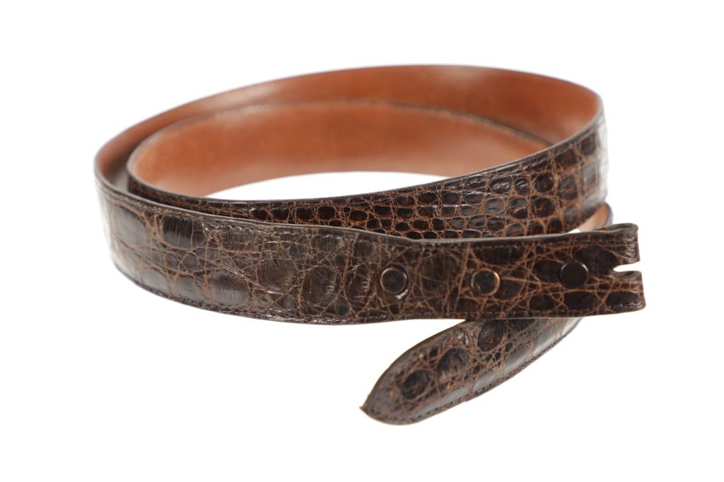 R. Stump/J. Rippel Genuine Caiman Crocodile Belt: Featured in this lot is this R. Stump / J. Rippel genuine caiman crocodile belt. The belt features a wonderfully and professionally crafted genuine caiman crocodile that shows great coloration to the 