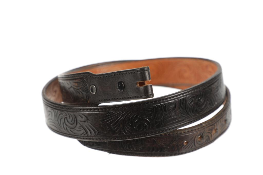 Double Sided Carved Western Cowboy Belt: Featured in this lot is this double sided carved western cowboy belt. The belt features a wonderfully and professionally crafted leather construction that shows that is is carved on both sides of the 