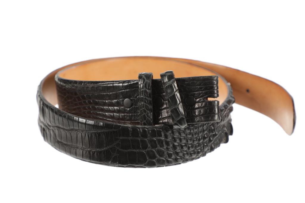 Hornback Alligator & Steer Hide Lined Belt: Featured in this lot is this Hornback Alligator and steer hide lined belt. The belt features a wonderfully and professionally crafted Hornback Alligator hide and steer hide construction. The belt on t