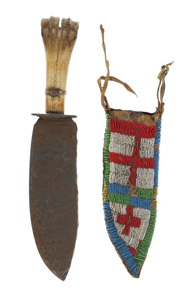 Northern Plains Sheath & Buffalo Bone Trade Knife: The lot features a Northern Plains beaded sheath and forged large bowie knife with Buffalo bone handle. The sheath appears to be of an older age and shows an Indian tanned Buffalo Bison hide with slig