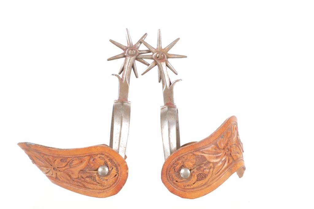 August Buermann Star Stamped Spurs c. 1930's: Featured in this lot is this August Buermann star stamped spurs circa 1930's. The spurs feature a wonderfully and professionally crafted stainless steel and leather construction that shows a beveled f