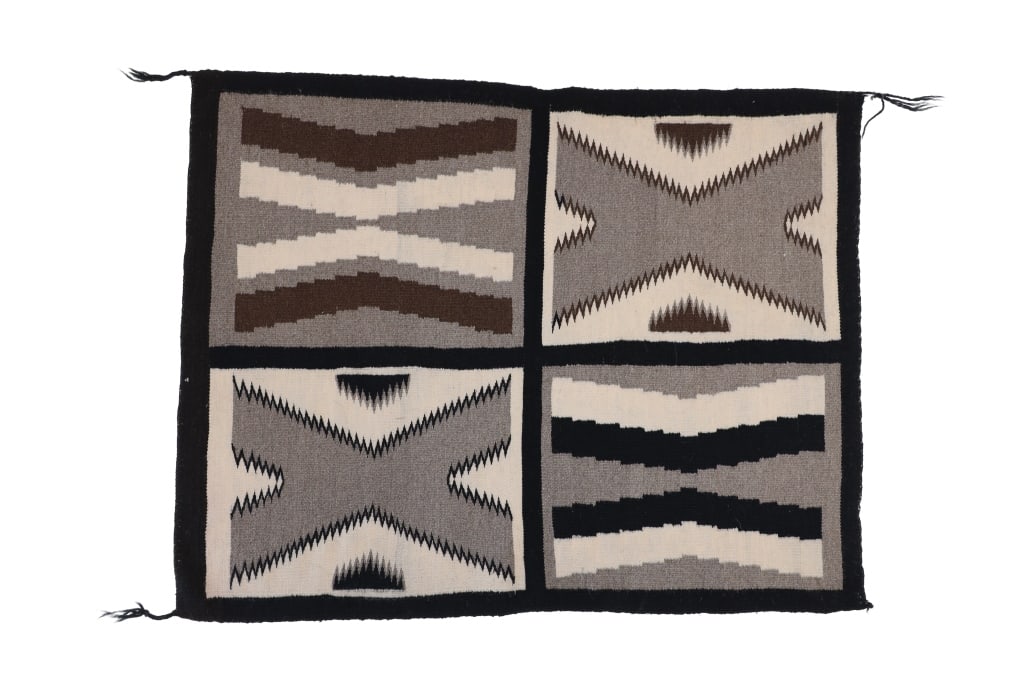 Navajo Multi Woven Salesman Sampler Rug: Featured in this lot is this Navajo Multi woven salesman sample rug. The rug features a wonderfully and professionally crafted wool construction. The rug features a four sectional display of samplers
