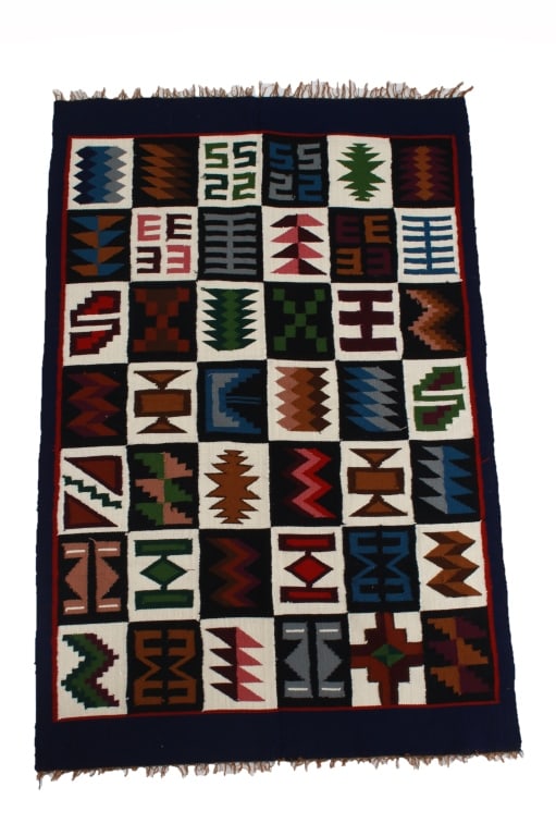 Zapotec Oaxaca Multi Sampler Saltillo Rug c. 1970s: Featured in this lot is this Zapotec Oaxaca multi sampler Saltillo rug circa 1970's. The rug features a wonderfully and professionally crafted wool construction that shows both ends of this rug shows